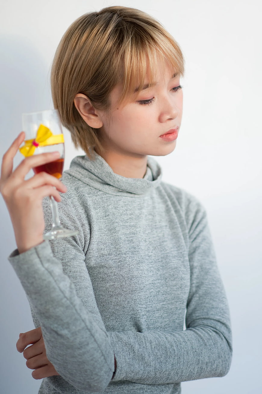 Woman with Short Hair Holding Wine Glass