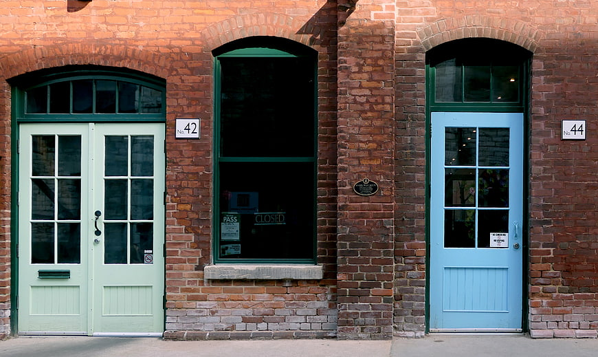 Colorful Doors on Red Brick Building Facade