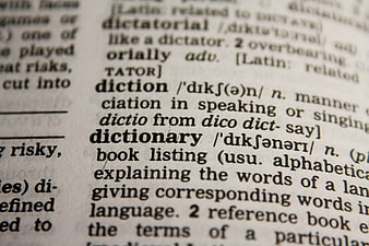 Close-up of dictionary page with definition of dictionary
