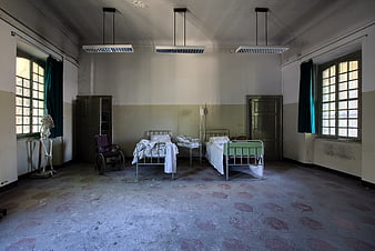 Abandoned Hospital Ward with Vintage Beds and Wheelchair