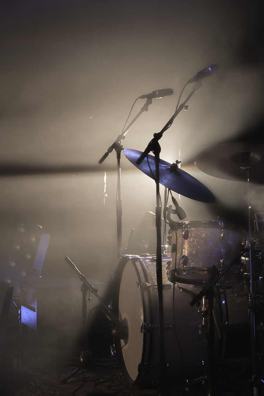 Atmospheric Drum Kit on Stage with Fog and Spotlights