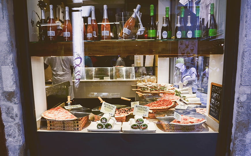 Italian Pizzeria Window Display with Pizza and Wine