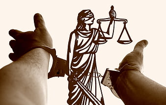 Handcuffed Hands Framing Lady Justice Silhouette