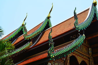 Traditional Thai Temple Roof with Green Naga Serpents