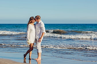 Romantic Couple Kissing on Beach Shoreline
