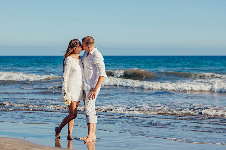 Romantic Couple Kissing on Beach Shoreline