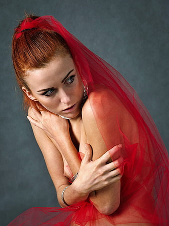 Emotional Portrait of Woman in Red Tulle Veil