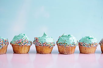 Mint Green Cupcakes with Sprinkles on Pink Background