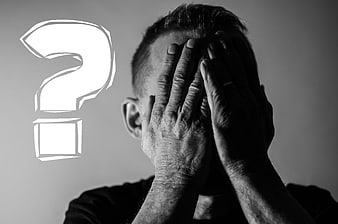 Man holding head in hands with large question mark graphic