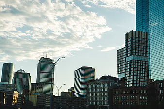 Modern City Skyline with Skyscrapers and Clouds