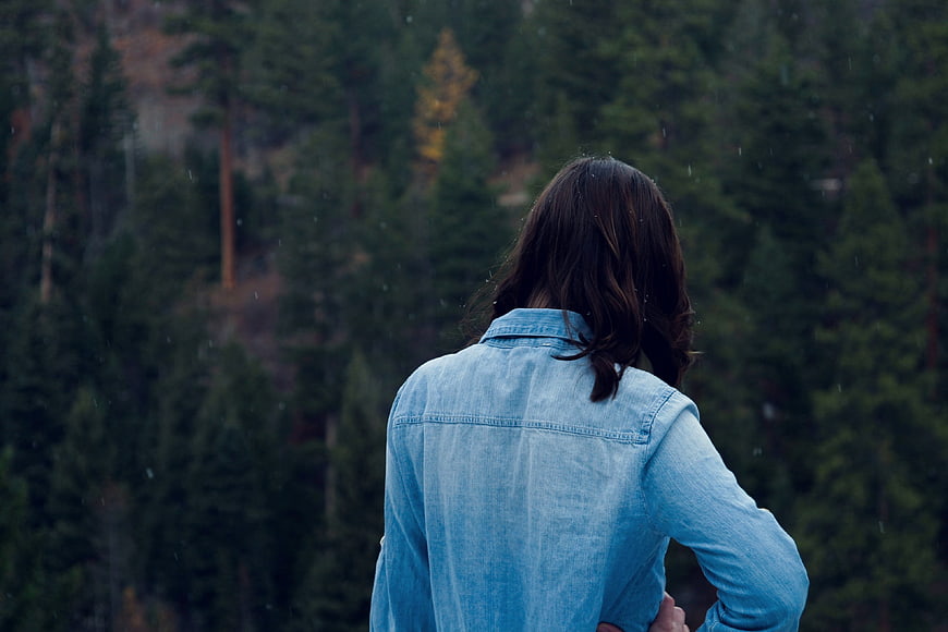 Woman in Denim Jacket Looking at Forest View