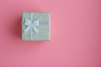 Elegant Gift Box With White Bow On Pink Background