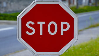 Close-up of Red Stop Sign on Roadside