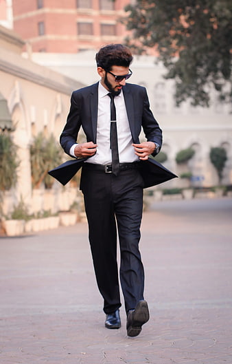 Stylish Man In Black Suit Walking Outdoors