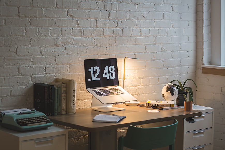Modern Home Office Desk with Laptop and Typewriter