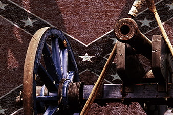 Historic Civil War Cannon Displayed Against Patriotic Starred Background