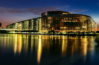 European Parliament Building at Night with River Reflection