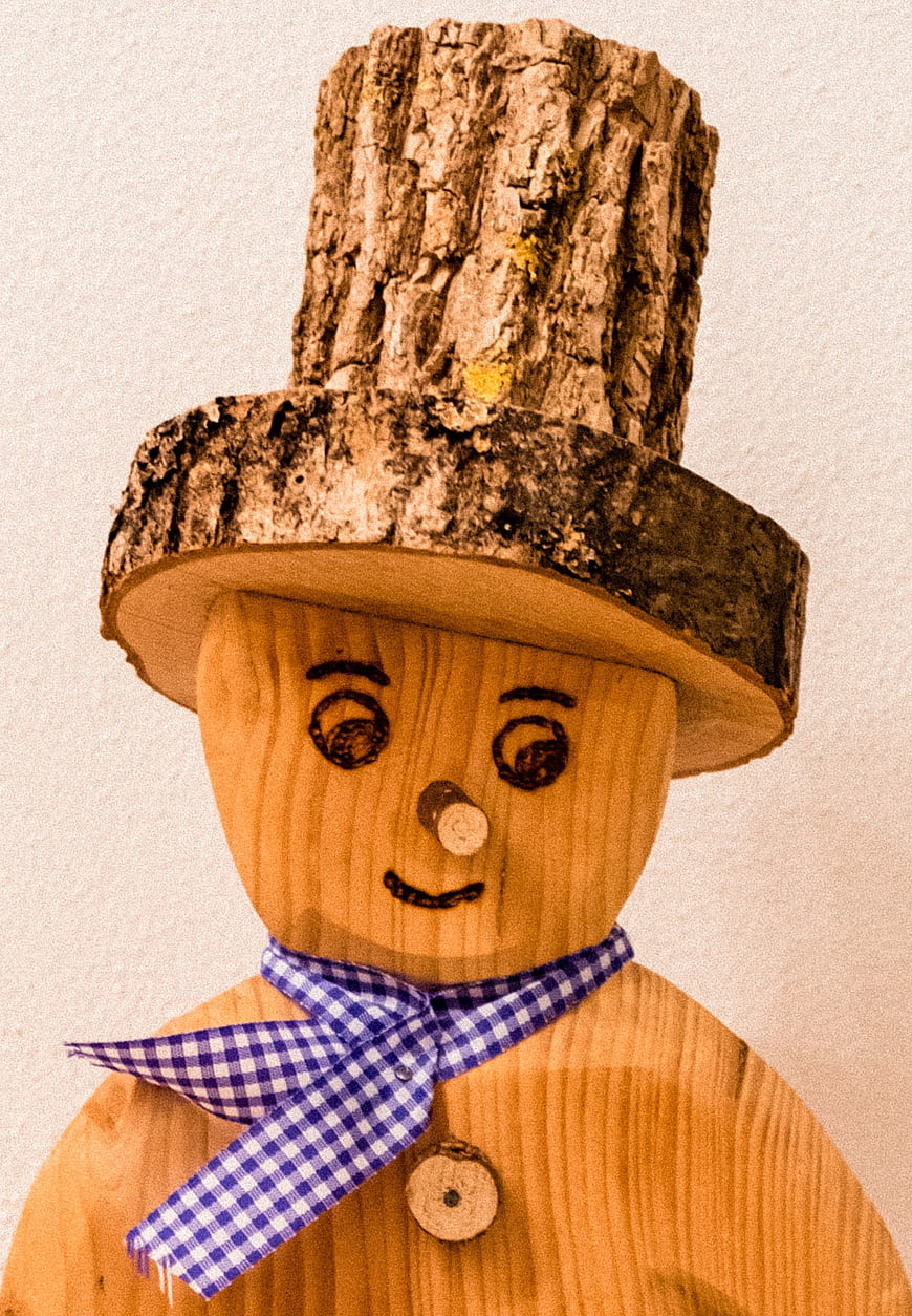 Handcrafted Wooden Snowman Figure with Plaid Scarf