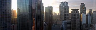 Panoramic City Skyline at Sunset with Modern Skyscrapers