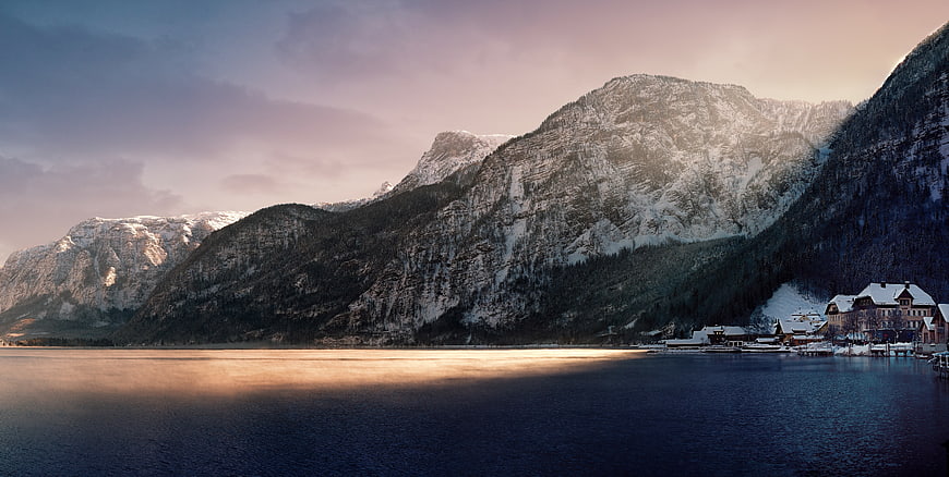 Snowy Mountain Lake Landscape at Sunset with Village