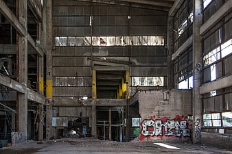 Interior of Abandoned Industrial Factory with Graffiti and Decay