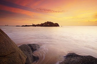Serene Sunset Seascape with Rocky Island and Smooth Water