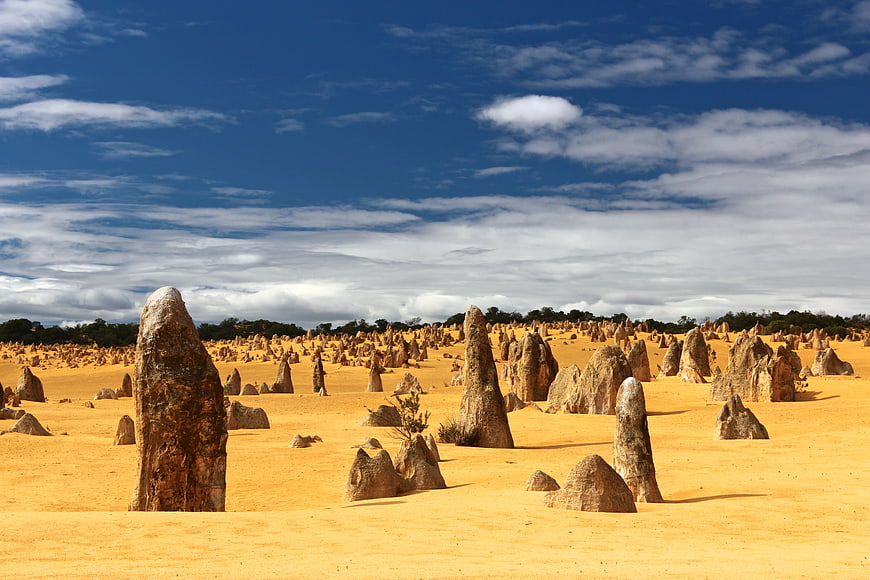 Pinnacles Desert Landscape with Limestone Formations and Blue Sky