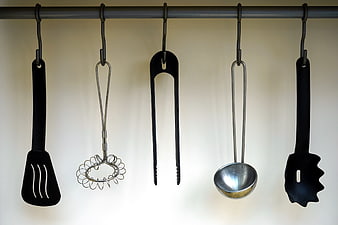 Hanging Kitchen Utensils on a Metal Rack