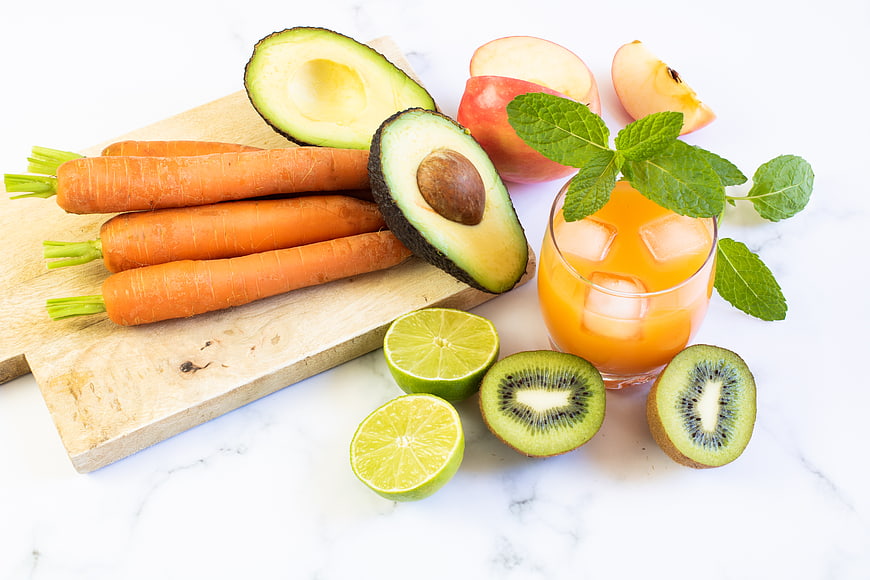 Fresh Healthy Juice Ingredients with Carrots, Avocado, and Kiwi
