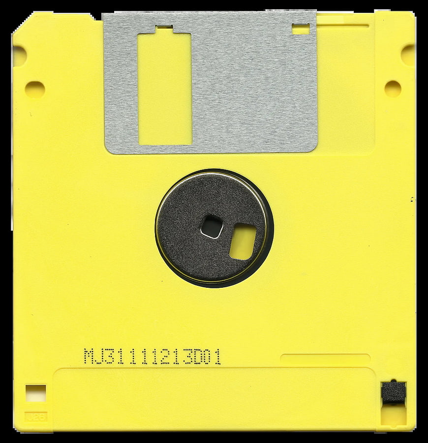 Yellow 5.25-inch floppy disk with black label and metal shield