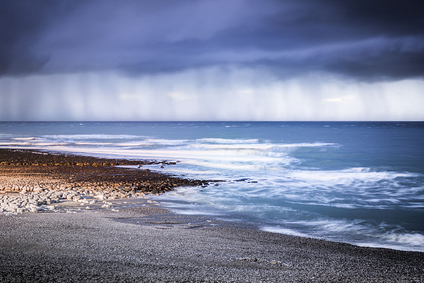 Dramatic Stormy Ocean Coastline with Rain and Waves
