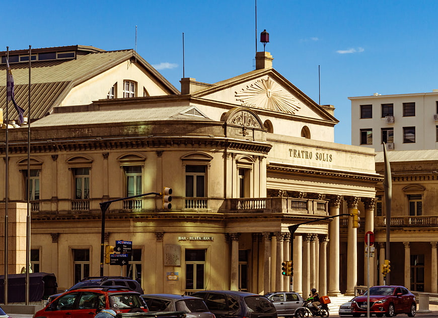Teatro Solis facade in Montevideo with cars and blue sky