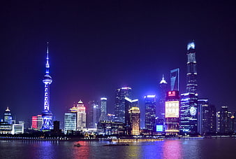 Shanghai Skyline Night View With Oriental Pearl Tower And Water Reflections