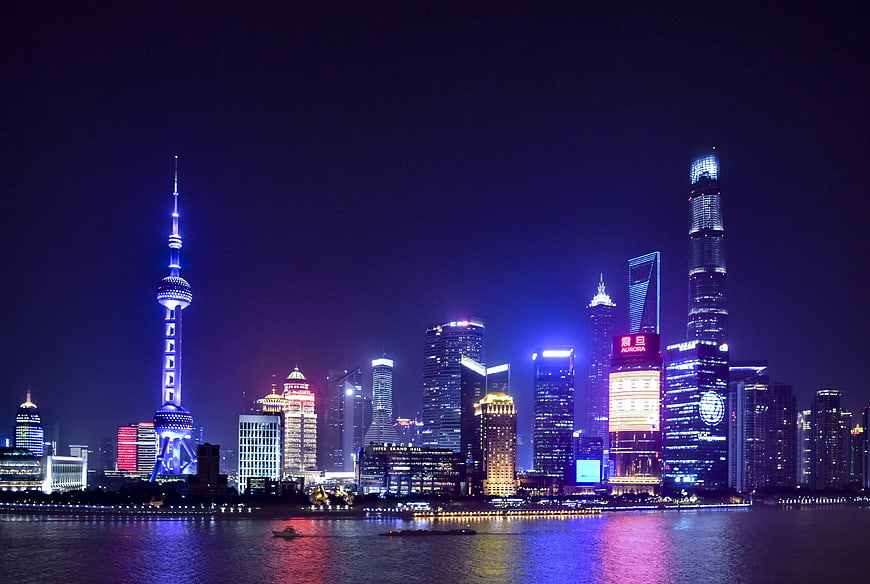 Shanghai Skyline Night View With Oriental Pearl Tower And Water Reflections