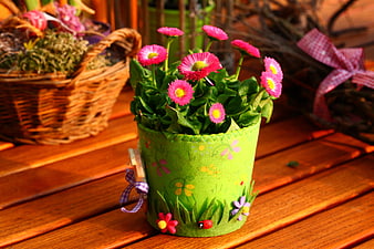 Handmade Green Flower Pot With Pink Daisies On Wooden Table