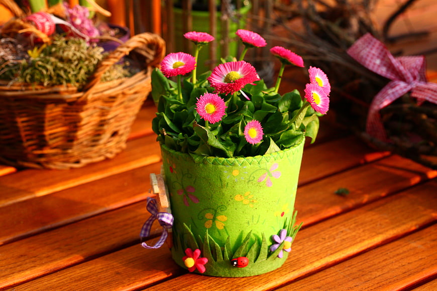 Handmade Green Flower Pot With Pink Daisies On Wooden Table