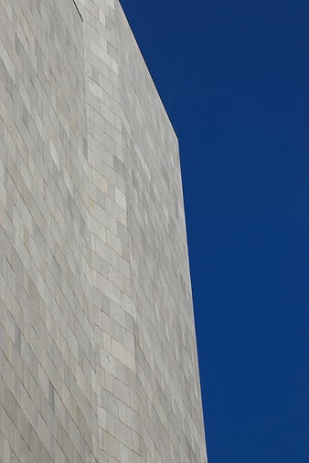 Modern Concrete Building Facade Against Blue Sky