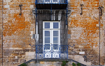 Vintage Stone Building Entrance with Blue Iron Railing