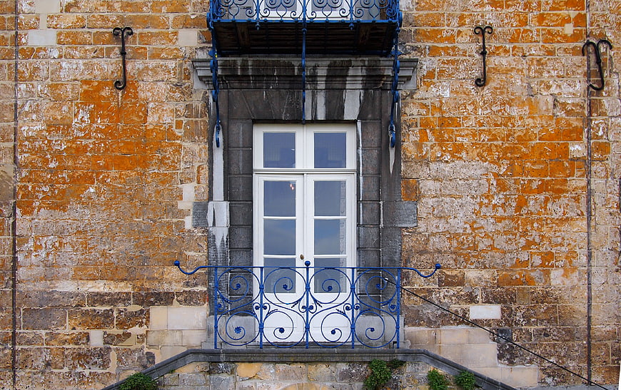 Vintage Stone Building Entrance with Blue Iron Railing
