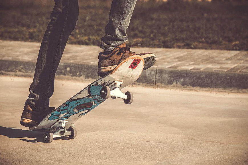Skateboarder performing a trick on a street