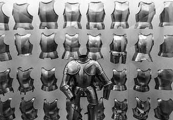 Full suit of medieval armor displayed with breastplate collection