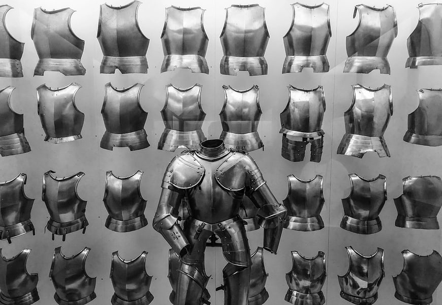Full suit of medieval armor displayed with breastplate collection