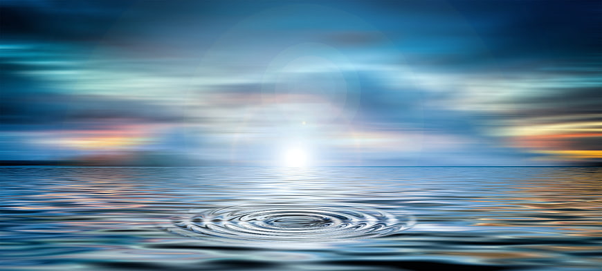 Serene Water Ripples at Sunset with Soft Sky Reflection