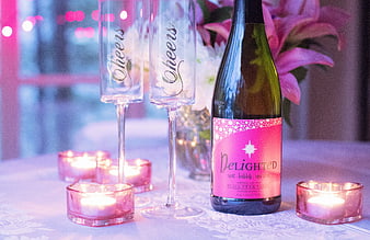 Romantic Wine Bottle and Cheers Glasses with Candles