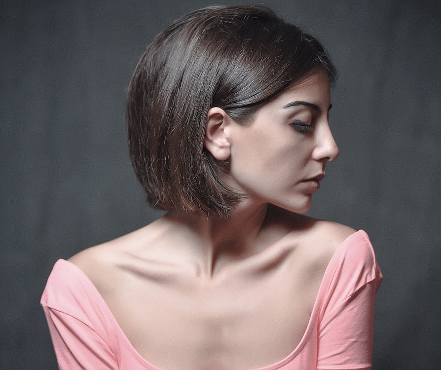 Profile Portrait of Woman with Short Hair and Pink Top