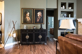 Modern rustic living room interior with black cabinet and art
