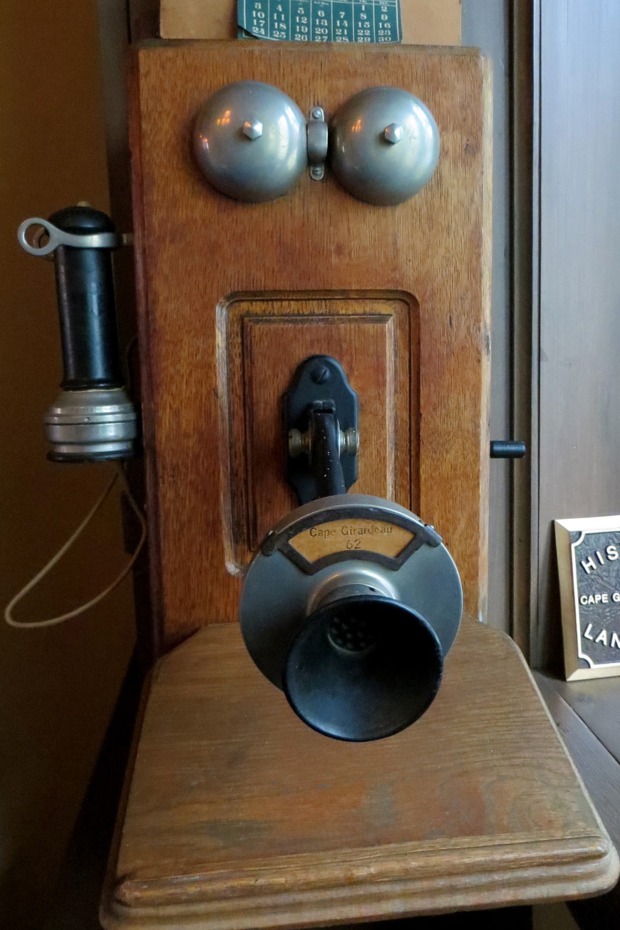 Vintage wooden wall-mounted telephone with bells