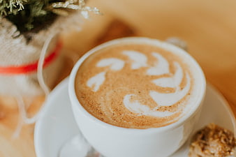 Close-up of Latte Art Coffee with Cookie and Christmas Decoration