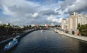 Moscow Kremlin and Moskva River Cityscape with Tourist Boat