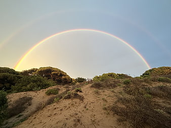 Double Rainbow Arching Over Coastal Sand Dunes